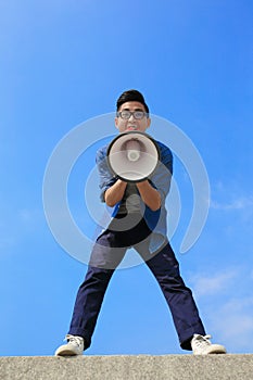 Young man shout megaphone