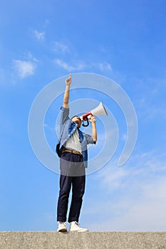 Young man shout megaphone