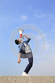 Young man shout megaphone photo
