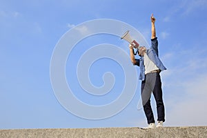 Young man shout megaphone