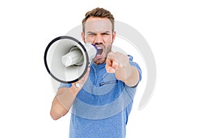 Young man shouting on horn loudspeaker