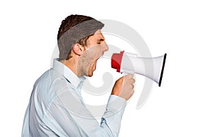 Young man shouting through megaphone