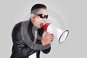 Young Man Shouting with Megaphone, Motivating Concept