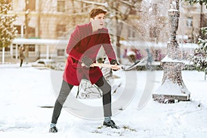 Young man shoveling snow