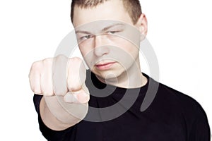 Young Man show the Fist. On white Background