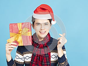 young Man showing Christmas present