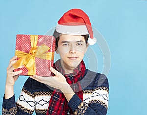 Young Man showing Christmas present