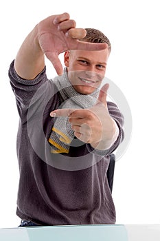 Young man showing directing hand gesture