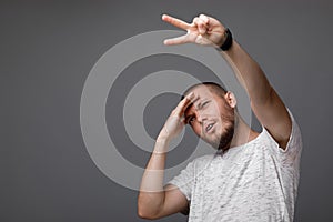 Young man showing gesture of victory