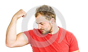 Young man showing his muscles