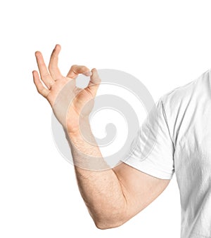 Young man showing OK gesture