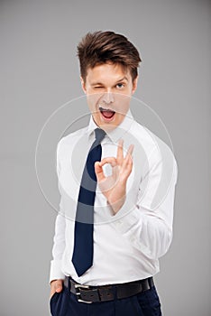 Young man showing ok sign