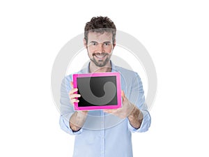 Young man showing a pink tablet