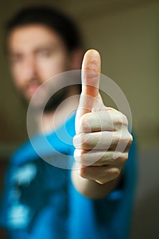 Young man showing sign okay photo