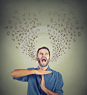 Young man showing time out hand gesture, frustrated screaming to stop