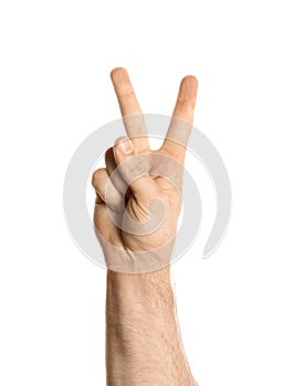 Young man showing victory gesture