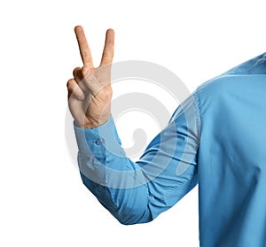 Young man showing victory gesture