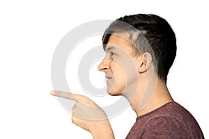 A young man shows a finger with a threat. Horizontal frame