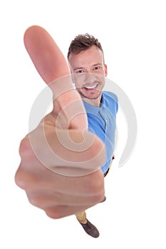 Young man shows thumb up sign