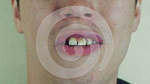 Young man sing song pronounce sounds in front camera. Open mouth. Face