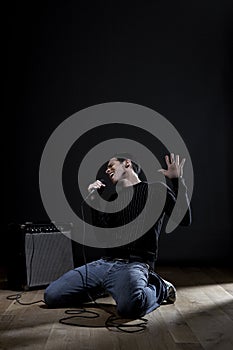 Young man singing into microphone close-up