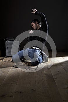 Young man singing into microphone close-up