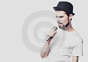 Young man singing with a microphone