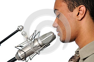 Young Man Singing into Vintage Microphone