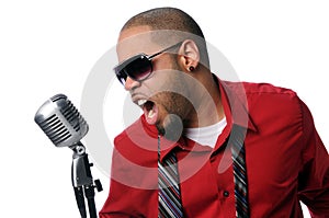 Young Man Singing Into Vintage Microphone