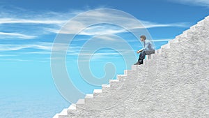 Young man sits on stairs