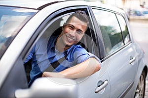 Young man sitting in a car