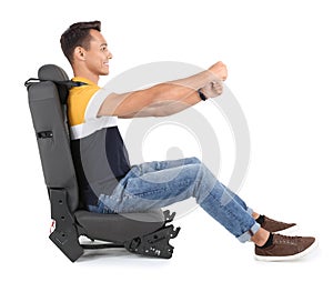 Young man sitting in car seat with safety belt