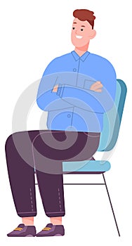 Young man sitting on chair. Bored guy waiting