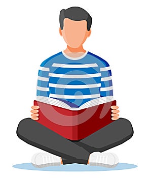 Young man sitting cross-legged and read book.