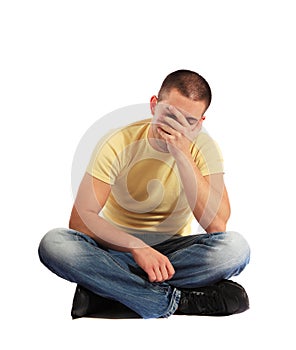 Young man sitting in desperate mood