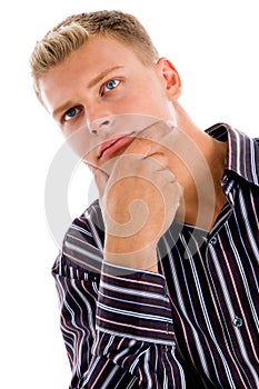 Young man sitting and facing the camera