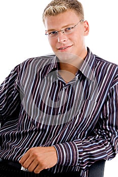 Young man sitting and facing the camera