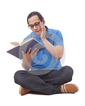 Young Man Sitting on Floor and Reading a Book, Shocked Gesture