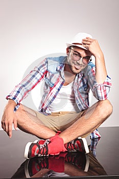 Young man sitting with his legs crossed