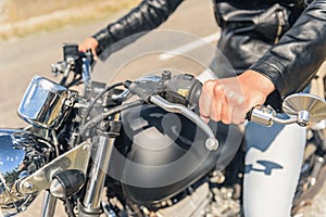 Young man sitting on his motorbike