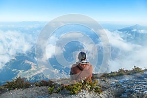 Bajawa - A man sitting on the top of the volcano, admiring the view