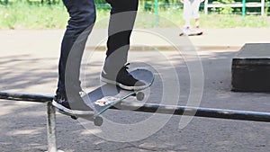 Young man is skating on skateboard in skate park. Freedom, sport concept