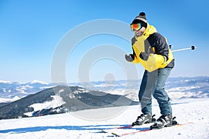 Young man skiing on hill. Winter vacation