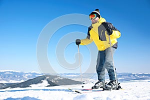 Young man skiing on hill. Winter vacation