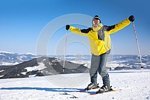 Young man skiing on hill. Winter vacation