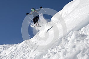 Young man skiing jumping