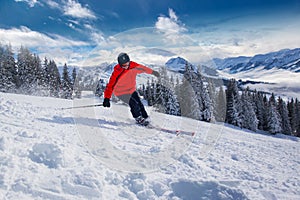 Young man skiing in Kitzbuehel ski resort in Tyrolian Alps, Austria