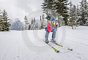 Young man skiing on the mountains off the track