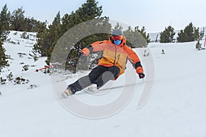 Young man skiing in the Pyrenees at the Grandvalira ski resort in Andorra in Covid-19 time