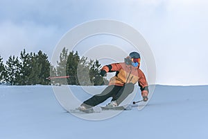 Young man skiing in the Pyrenees at the Grandvalira ski resort in Andorra in Covid19 time